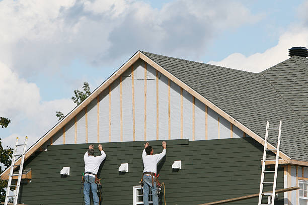 Professional Storm Damage Siding Repair technician working in Coshocton, OH